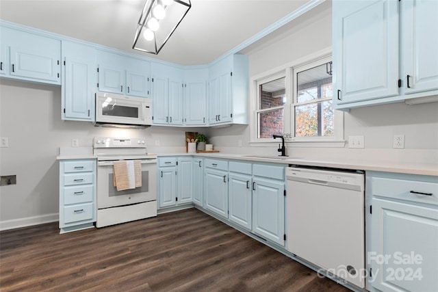 kitchen with dark hardwood / wood-style flooring, white appliances, white cabinetry, and sink