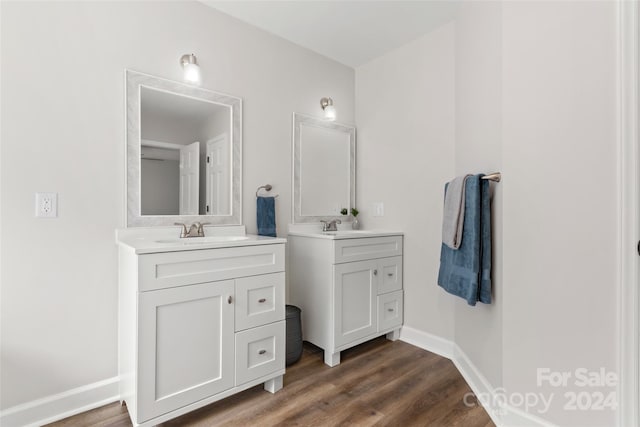 bathroom with vanity and hardwood / wood-style flooring