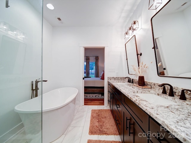 bathroom with a bathing tub and vanity