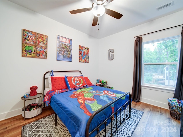 bedroom featuring hardwood / wood-style flooring and ceiling fan