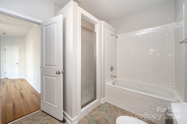 bathroom featuring hardwood / wood-style floors and independent shower and bath