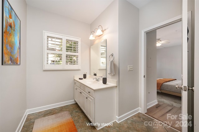 bathroom featuring hardwood / wood-style floors, vanity, and ceiling fan