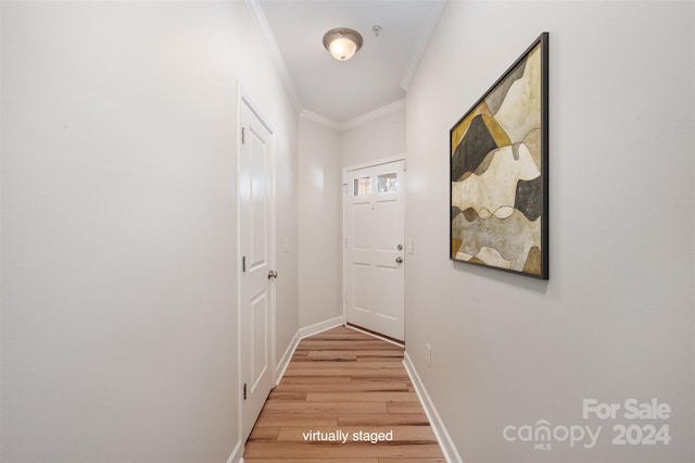 hallway with crown molding and light wood-type flooring