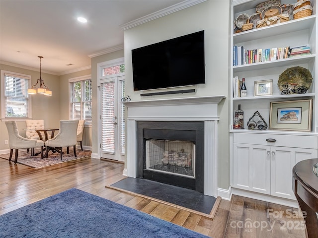 living room featuring ornamental molding and dark hardwood / wood-style floors