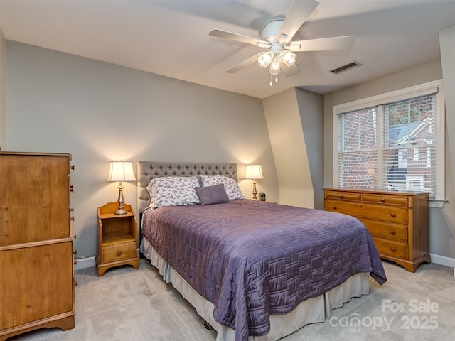 bedroom featuring ceiling fan and light carpet