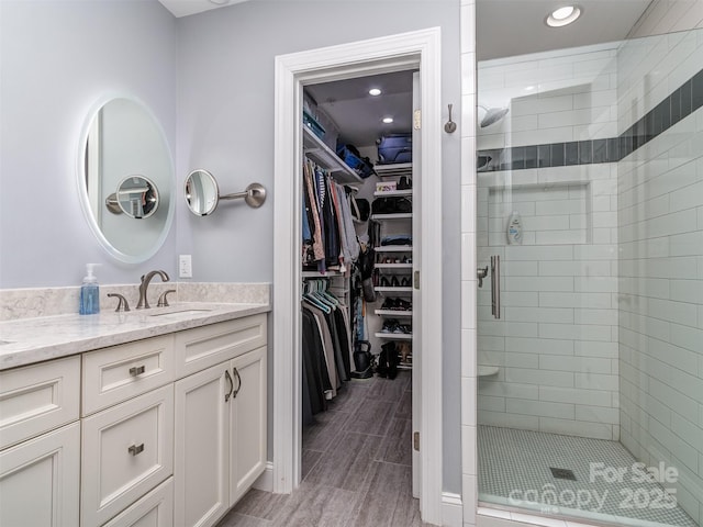 bathroom with vanity and walk in shower