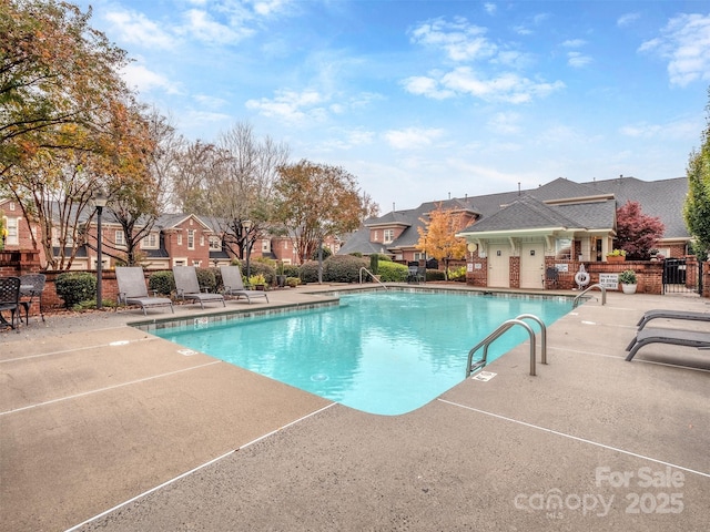 view of swimming pool featuring a patio