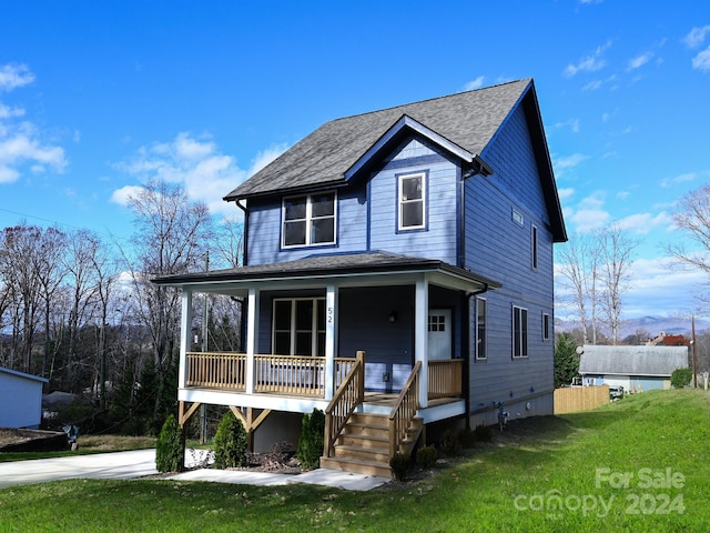 view of front of house featuring a porch and a front lawn