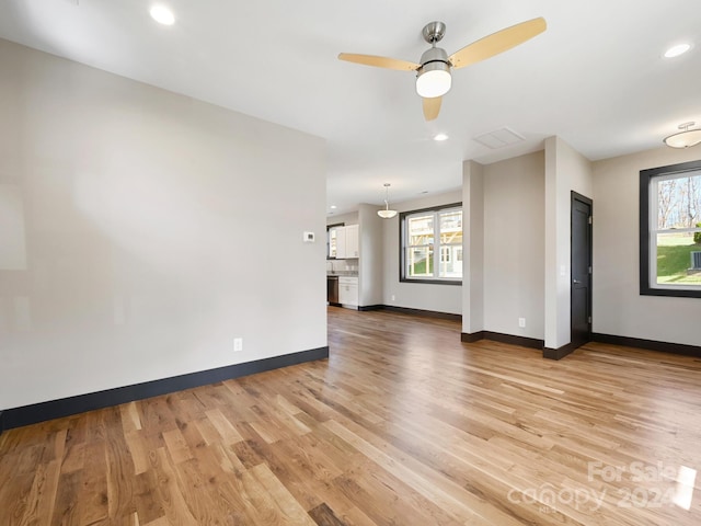 interior space featuring ceiling fan and light hardwood / wood-style floors