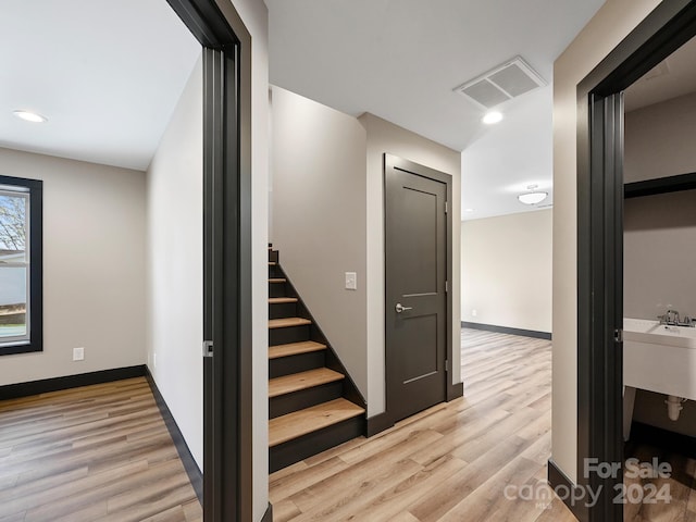 stairway featuring hardwood / wood-style flooring