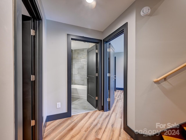 corridor featuring light hardwood / wood-style flooring