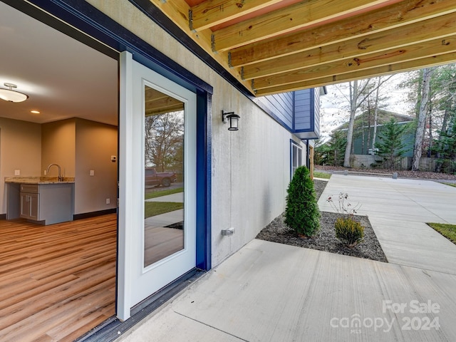 entrance to property with a patio