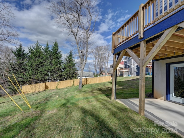 view of yard with a patio and a wooden deck