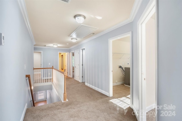 corridor with light carpet and crown molding