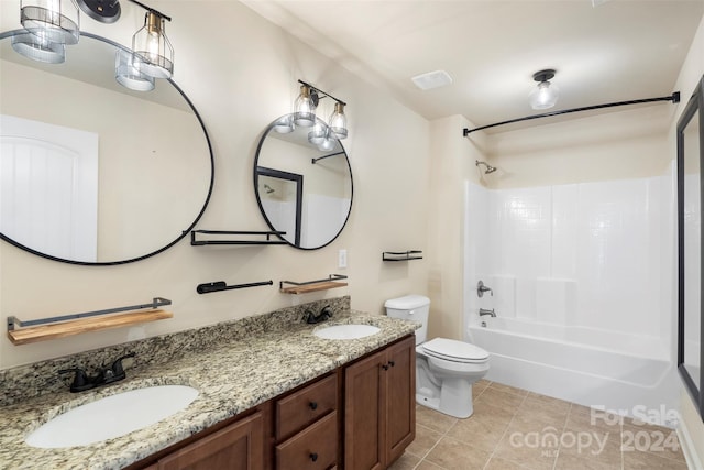 full bathroom featuring tile patterned floors, vanity, toilet, and washtub / shower combination