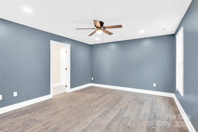 empty room featuring ceiling fan and wood-type flooring