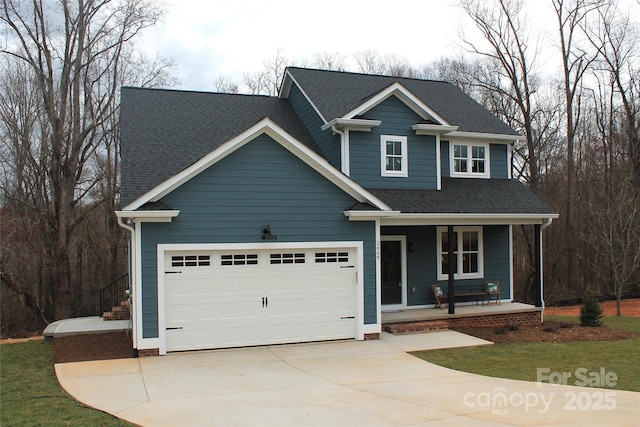 traditional-style home with a porch, concrete driveway, and roof with shingles