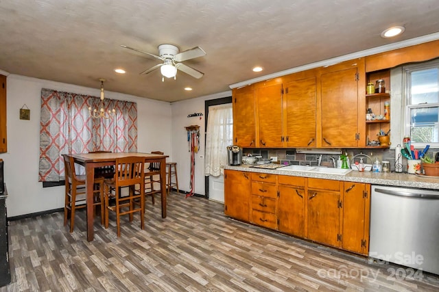 kitchen with ceiling fan, crown molding, sink, dishwasher, and light hardwood / wood-style floors