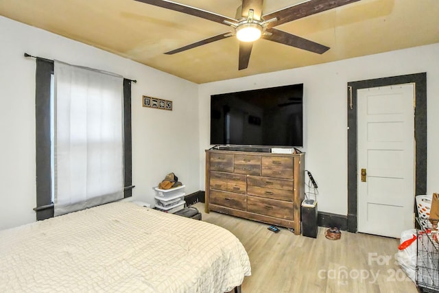 bedroom with ceiling fan and light wood-type flooring