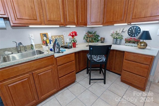 kitchen with sink and light tile patterned floors