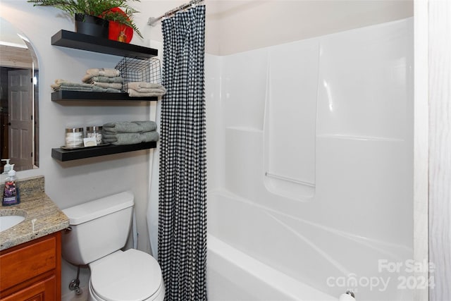 full bathroom featuring vanity, toilet, and shower / bathtub combination with curtain