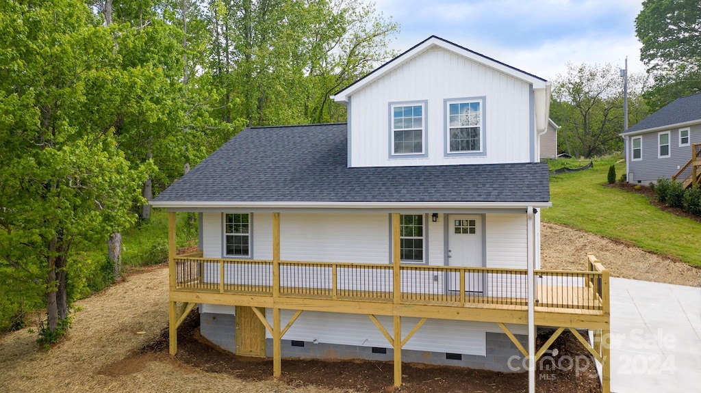 back of property featuring a deck