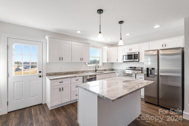 kitchen with white cabinets, a healthy amount of sunlight, and appliances with stainless steel finishes