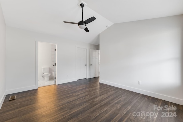 unfurnished bedroom with ceiling fan, dark hardwood / wood-style flooring, ensuite bathroom, and lofted ceiling