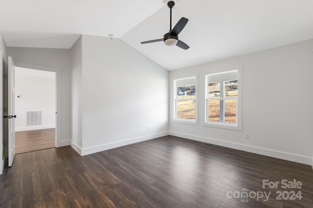 unfurnished room featuring ceiling fan, dark hardwood / wood-style flooring, and lofted ceiling