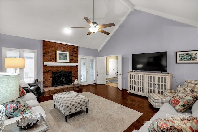 living room featuring a brick fireplace, high vaulted ceiling, ceiling fan, and dark wood-type flooring