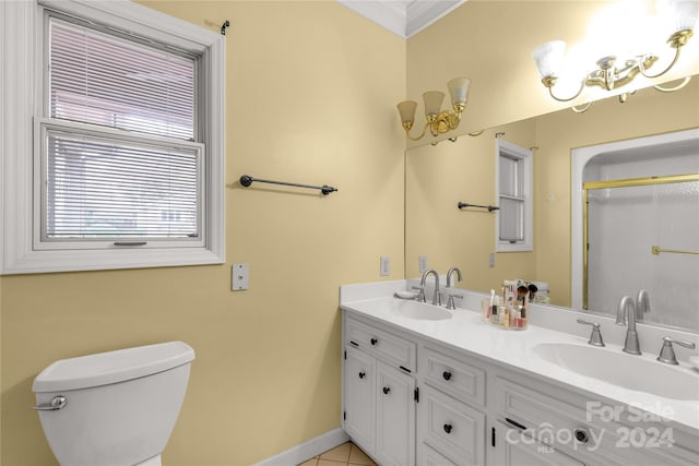 bathroom featuring tile patterned flooring, vanity, toilet, and crown molding