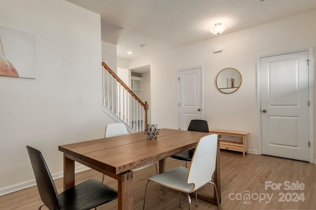 dining area with light hardwood / wood-style floors