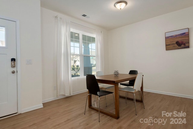 dining space featuring light hardwood / wood-style floors