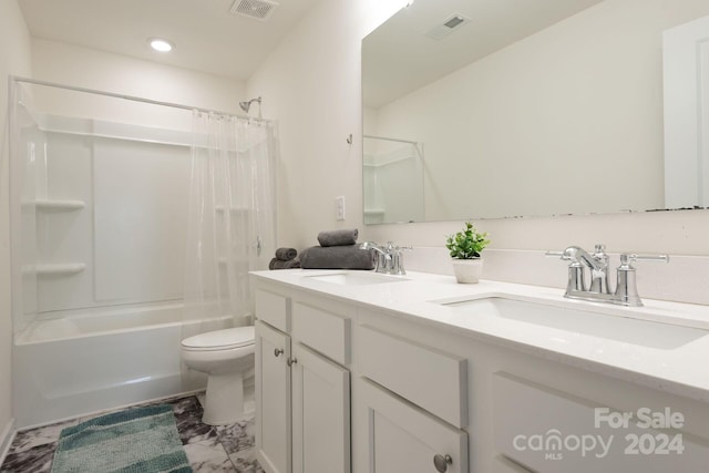 full bathroom with shower / tub combo, vanity, and toilet