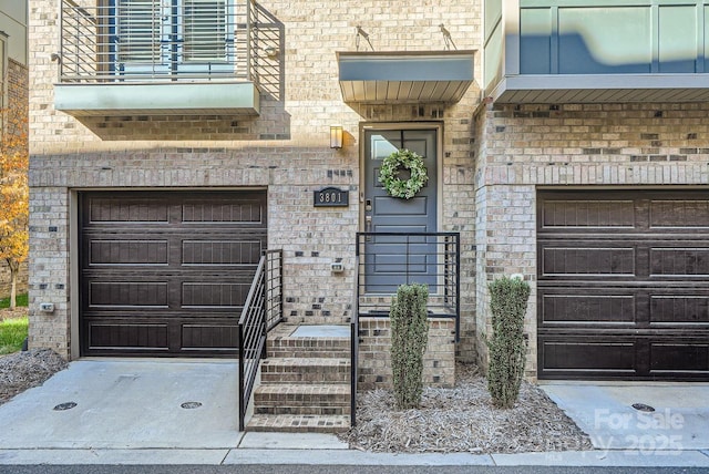 view of exterior entry featuring a garage