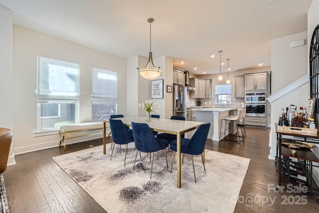 dining space featuring dark hardwood / wood-style floors