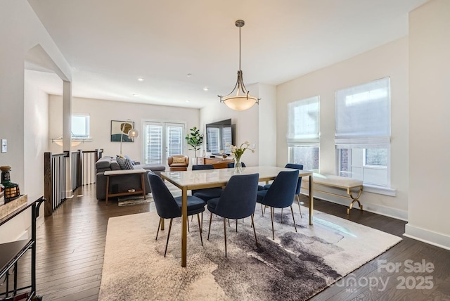 dining area featuring dark hardwood / wood-style flooring