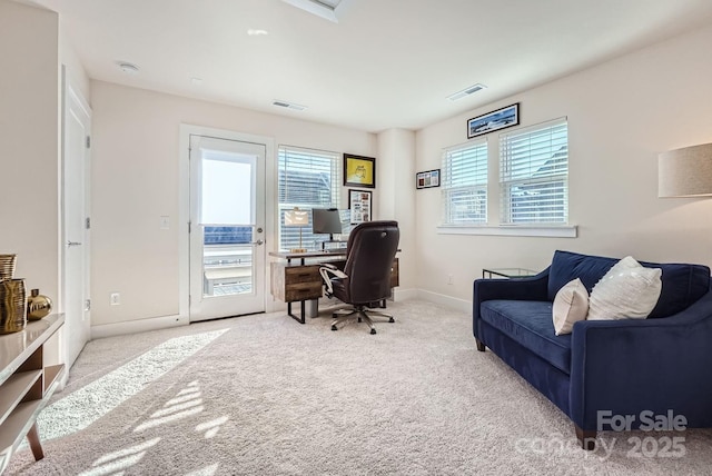 office featuring light colored carpet and a wealth of natural light