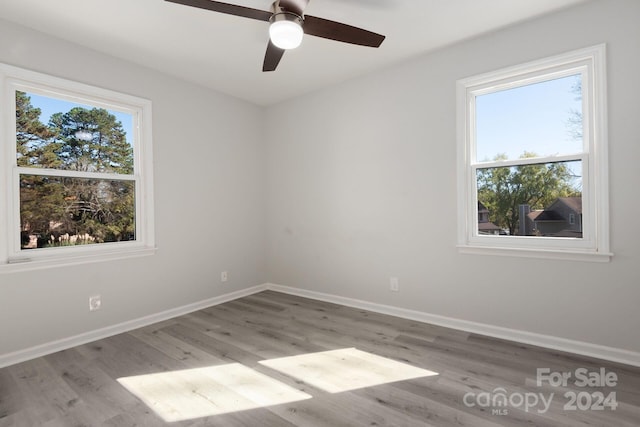7704 Cedar Bluff Ln, Charlotte, NC 28227 - unfurnished room featuring light hardwood / wood-style flooring and ceiling fan