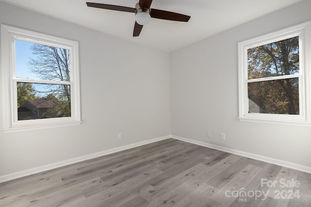 7704 Cedar Bluff Ln, Charlotte, NC 28227 - spare room featuring ceiling fan and light wood-type flooring