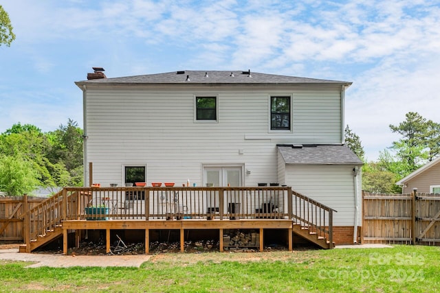 7704 Cedar Bluff Ln, Charlotte, NC 28227 - rear view of property featuring a lawn and a wooden deck