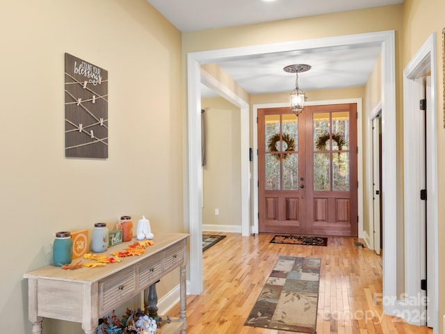 entrance foyer with light wood-type flooring