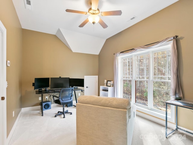 carpeted home office with ceiling fan and lofted ceiling