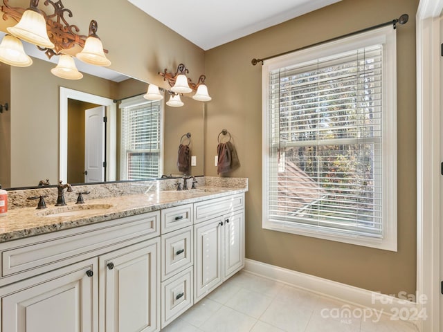 bathroom with tile patterned flooring and vanity