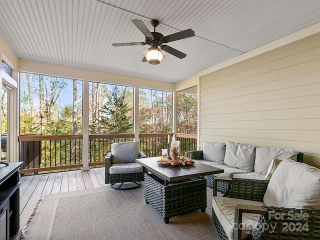 sunroom featuring ceiling fan