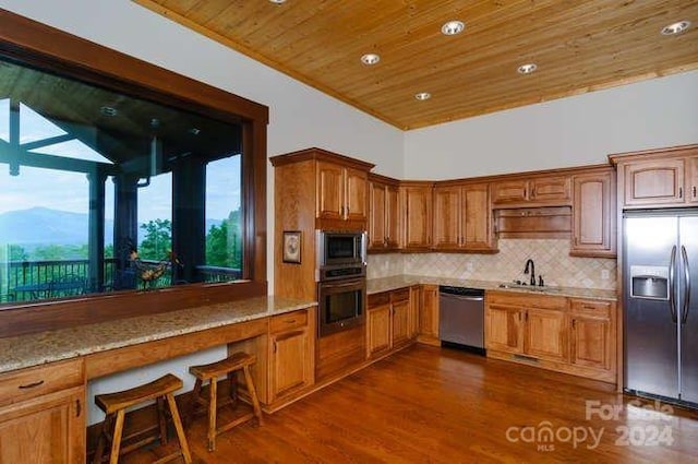 kitchen with light stone countertops, appliances with stainless steel finishes, sink, wooden ceiling, and dark hardwood / wood-style floors