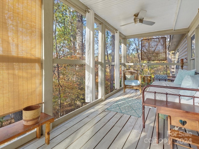 sunroom with plenty of natural light and ceiling fan