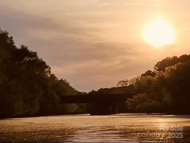 nature at dusk featuring a water view