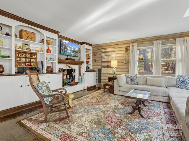 living area with wood finished floors and log walls