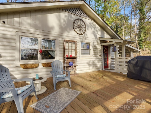 wooden deck featuring grilling area
